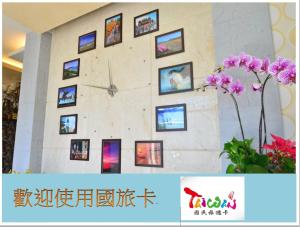 a wall of pictures on the wall of a building at Kenting Garden Homestay in Kenting