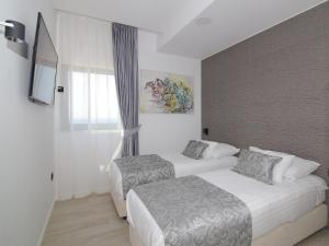 Postel nebo postele na pokoji v ubytování Luxury Amarin Apartment