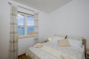 Postel nebo postele na pokoji v ubytování Raos in Trogir - Mittel-Dalmatien