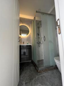 a bathroom with a shower and a sink and a toilet at Luna Alacati in Alacati +207 photos