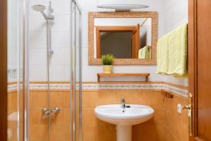 a bathroom with a sink and a shower at Pleamar in Famara +13 photos