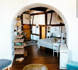 a bedroom with a bed and a book shelf at Schloßschänke Eysölden in Thalmässing