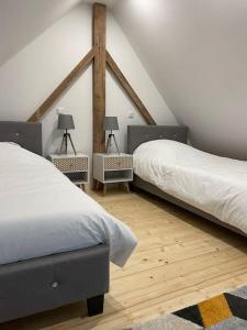 Katil atau katil-katil dalam bilik di Gîte à 10 min d'Europa-park