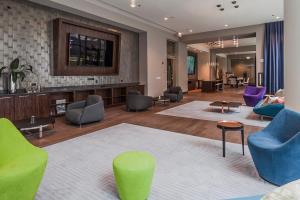 a lobby with colorful chairs and a living room at Loop Studio w Gym Pool nr Chicago Riverwalk CHI-240 in Chicago