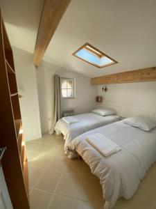 Postel nebo postele na pokoji v ubytování Gîte Chez Tiramisù avec piscine
