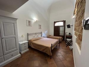 Posteľ alebo postele v izbe v ubytovaní B&B Cinisi Vacanze