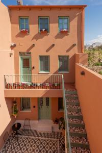 a building with a staircase leading up to it at Sartori Concept Hotel in Heraklio