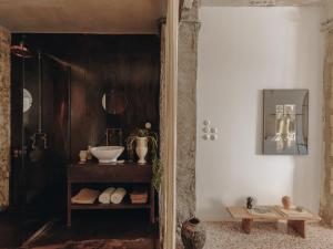 a bathroom with a sink and a mirror at Mona Athens in Athens