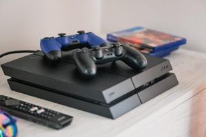 a video game controller sitting on top of a box at Pearl House - Sirmione Holiday - Jacuzzi Privata in Sirmione