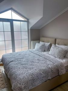 a bedroom with a large bed and a large window at Super value in Istanbul