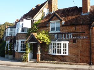 a brick building with a sign that reads the milliken of managed at Miller of Mansfield in Goring