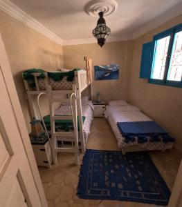Llit o llits en una habitació de Taghazout Ocean View