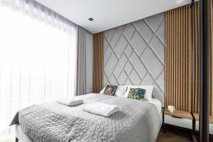 Posteľ alebo postele v izbe v ubytovaní Apartment Antalovka Residence & Spa