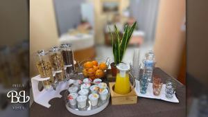 a table with food and drinks and other items on it at Bella Vista B&B in Gissi