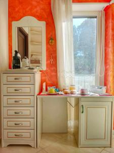 a kitchen with a white counter and a window at B&B Arcobaleno in Potenza