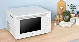 a microwave oven sitting on top of a table at HOTEL ZERO in Tatsuno
