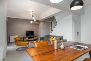 a living room with a couch and a table at Napier Maisonette in Argostoli