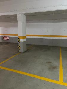 an empty parking garage with an empty parking lot at Centro de Miño - Pumariega in Miño