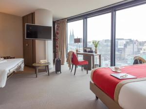 Postel nebo postele na pokoji v ubytování Mercure Clermont Ferrand centre Jaude
