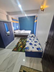 מיטה או מיטות בחדר ב-Hotel Homestay Inn