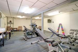 a gym with treadmills and exercise bikes in a room at Quality Inn & Suites in Lincoln