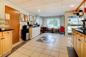 a large kitchen with a table and a dining room at Quality Inn & Suites in Lincoln