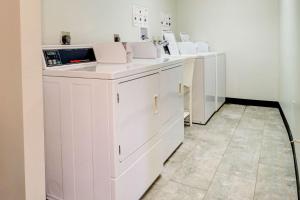 a row of white cabinets in a room at Quality Inn & Suites in Lincoln