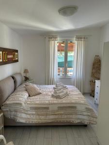 Ένα ή περισσότερα κρεβάτια σε δωμάτιο στο La casa di Ely