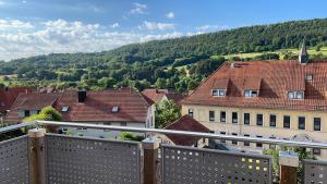 a view from a balcony of a town with houses at Sonniges Ferienapartment am Alten Binauer Schloss 