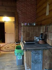 a kitchen with a counter and a trash can at u Piwowara in Kościelisko