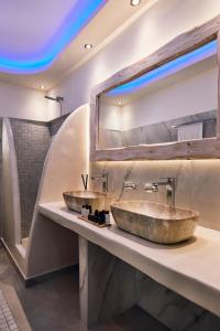 two sinks on a counter in a bathroom at Soultouch Beachfront Villa in Perissa