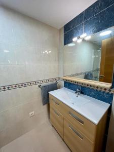 a bathroom with a sink and a mirror at Centro de Miño - Pumariega in Miño +32 photos