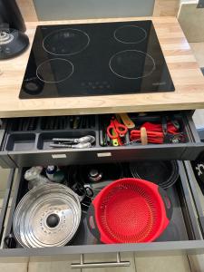 a drawer in a cabinet filled with tools at Au coeur de CASSIS in Cassis