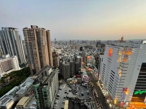a city skyline with tall buildings and traffic at Artistic Studio in Taichung