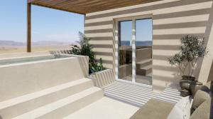 a house with a balcony with a view of the desert at Princess Luxury Suites Adults Only - Princess Hotels Collection in Agia Anna Naxos