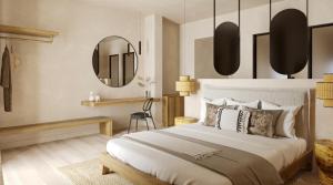 a bedroom with a large bed and a mirror at Princess Luxury Suites Adults Only - Princess Hotels Collection in Agia Anna Naxos