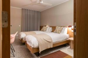 Letto o letti in una camera di Gozo Harbour Views, Mgarr Heights