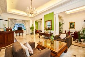 a living room with a couch and a table at Orchid Garden Suites in Manila