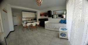a bedroom with a bed and a table and chairs at HAPPY LOiX 1 APARTMENT in Benidorm