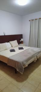 En eller flere senge i et værelse på LAGO AZUL 45