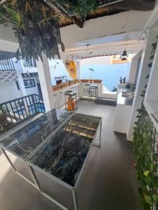 a room with a glass table in a building at Arthur Private Resort in Legazpi