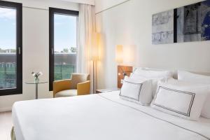 Postel nebo postele na pokoji v ubytování Melia Luxembourg