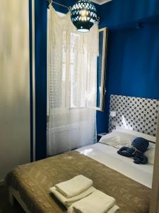 Postel nebo postele na pokoji v ubytování B&B Via dell'Azzurra