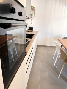 Kuchyň nebo kuchyňský kout v ubytování Priziúsa + 37 fotografií