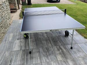 a ping pong table sitting on top of a floor at Ferienwohnung Hermann in Techelsberg am Wörthersee in Karnten