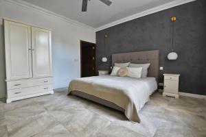 Postel nebo postele na pokoji v ubytování Villa Marni