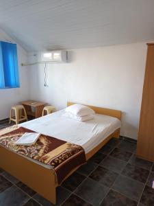 Giường trong phòng chung tại Vila Mia