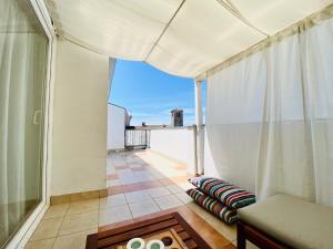 a room with a balcony with a view of the ocean at Pet-friendly two-room family apartment in magical Bale in Bale