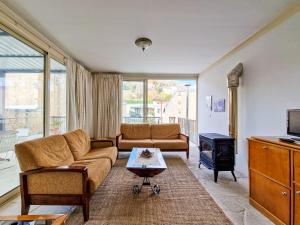 a living room with a couch and a stove at Sanders Village in Vasa Kilaniou