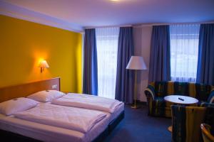 Posteľ alebo postele v izbe v ubytovaní Hotel Strohofer